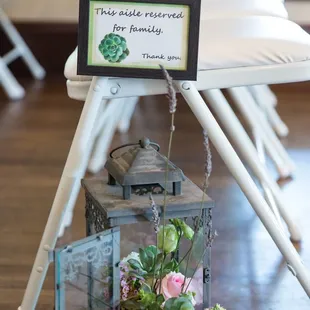 Lanterns were stuffed with flowers and used along the aisle