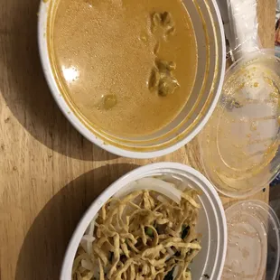 two bowls of soup and noodles