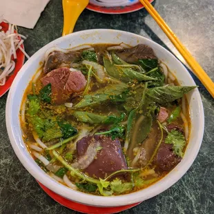 a bowl of beef and broccoli soup