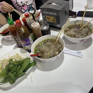 Beef fillet pho left -- ox tail + meatballs + beef fillet pho right