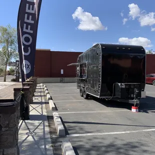 a coffee truck parked in a parking lot