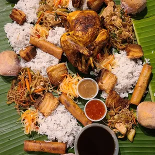 a pile of food on a banana leaf