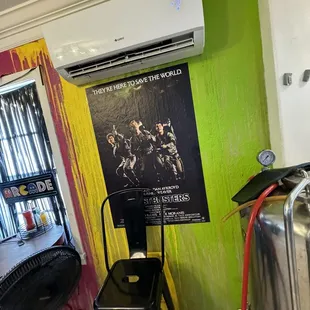 a movie poster on the wall