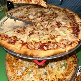 two pizzas on a platter
