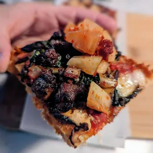 Seoul Pizza. Kimchi tomato sauce, pork belly, shiitake, pear, bacon.  Just ok