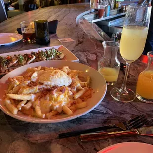 The life-changing brunch Texas poutine. Caprese app excellent too. Pineapple mimosas sre bomb...