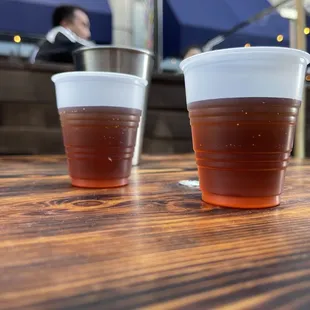 two cups of beer on a table