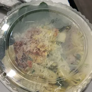 a plate of pasta and meat