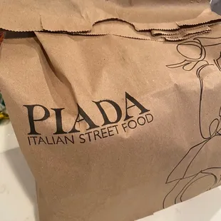 Piada takeout bag from Piada Italian Street Food