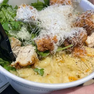 a person holding a bowl of food