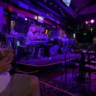 a man holding a glass of wine