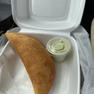 Beef empanada and a tasty crème dressing