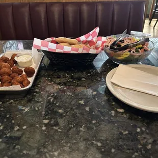 Fried mushrooms, garlic rolls, and an antipasto salad.