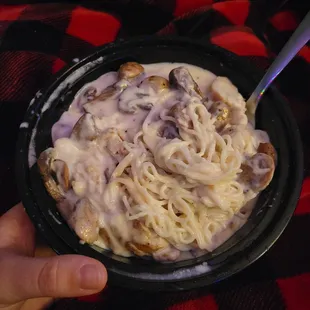 Angel hair pasta with Alfredo sauce, mushrooms, chicken.