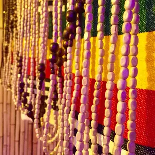 a row of beads hanging on a wall