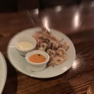 two plates of food on a wooden table