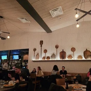 Love the pizza paddles on the wall