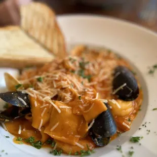 a plate of pasta and bread