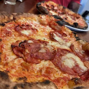 a pizza with pepperoni and cheese