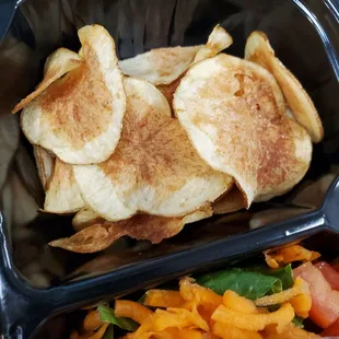 Homemade chips and salad