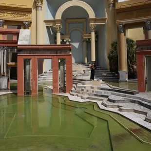 take pictures like you're a Grecian statue. dirty green water gives off an "abandoned 'cause no one cares about this place" vibe