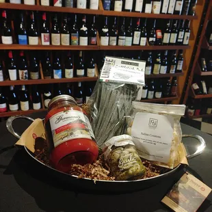 Germano's Pomodoro sauce, cuttlefish ink linguine pasta, marinated garlic with herbs, and house-made Italian crouton in a deBuyer frying pan