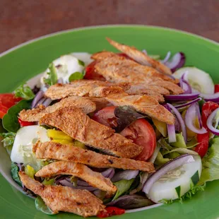 variety of salads with the option to add chicken or shrimp