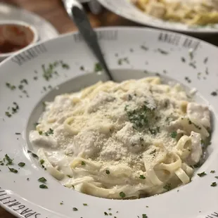 Fettucine Alfredo with chicken (front), Spaghetti Alla Carbonara (back)