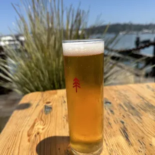 a glass of beer on a table