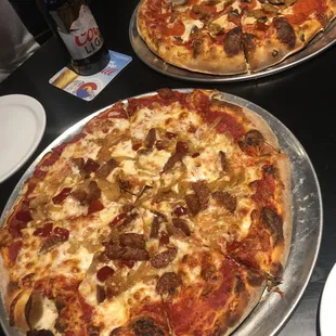 Elk sausage pizza and the supreme type pizza