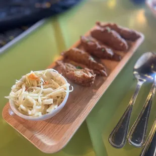 a plate of fried chicken and coleslaw