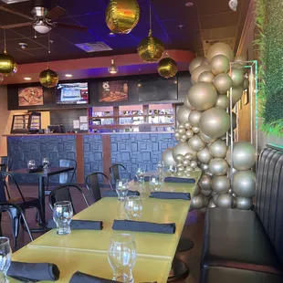 a dining area with tables and chairs