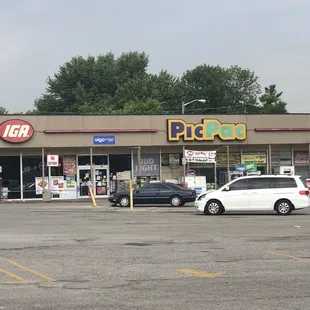 parking lot with cars parked in front