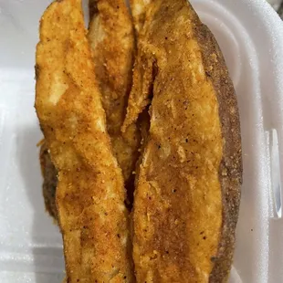 a close up of a piece of fried fish
