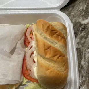 a sandwich in a styrofoam container
