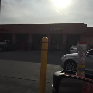 a parking lot with cars parked in it