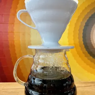 Pour over with mural in the background.