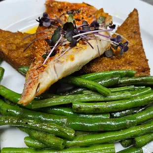 Crimson Snapper with polenta and salsa Mancha.