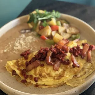 Meat filled omelet with bacon and chorizo! So good!!