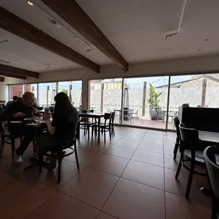 Modern, bright big inside and outside dining areas, cool concrete factory next door