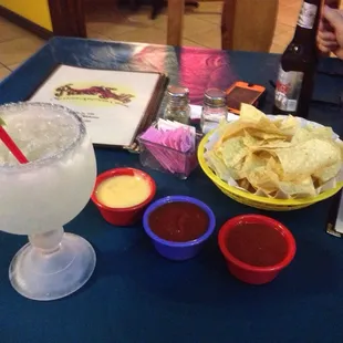a table with chips and drinks
