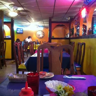 a restaurant with tables and chairs