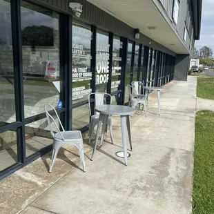 Two tables in the front of the shop.