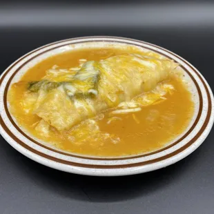 Enchilada Ranchera. Choose chicken, beef, or cheese inside!