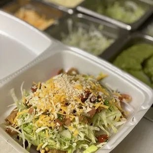  salad in a styrofoam container