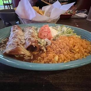 Mexico City - 3 enchiladas (one beef, one chicken, and one cheese) with rice, lettuce, tomato, and sour cream