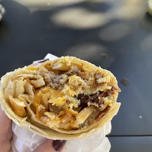 Breakfast burrito with sausage and bacon