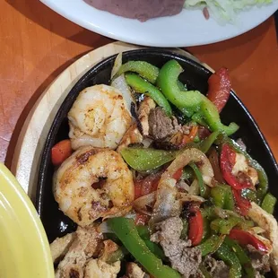 Shrimp, chicken and steak fajitas