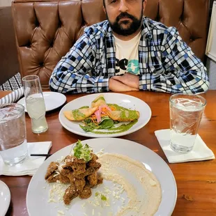 Vegan Portobello Fries (foreground) and vegan Impossible Empanadas (background)