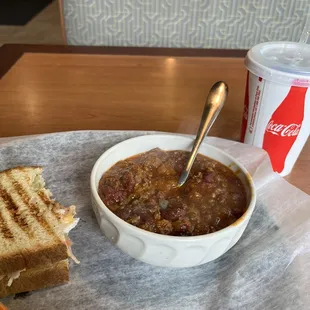 a bowl of chili and a sandwich